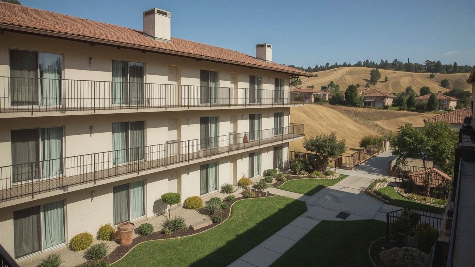 Matching metal balcony railings on a Tri-Valley apartment building
